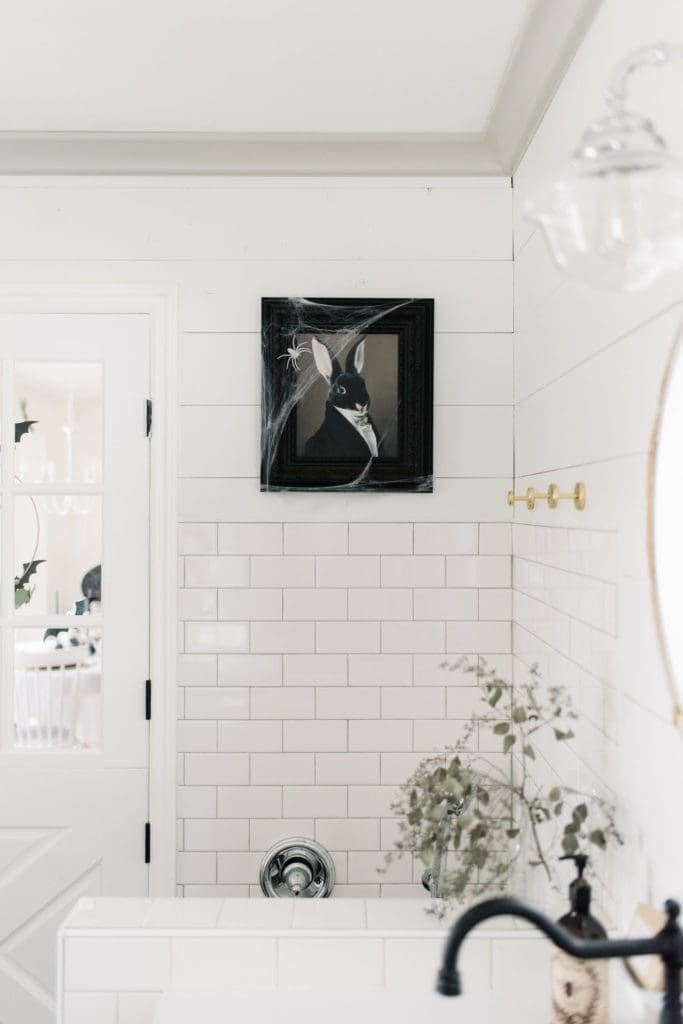 Cobwebs and spiders from the dollar store are a budget friendly way to decorate for halloween
