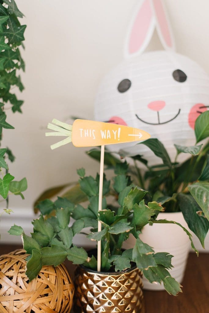 A sign in the shape of a carrot that says \"this way\"