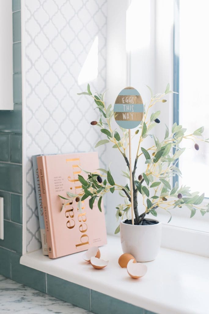 A plant with an Easter egg sign