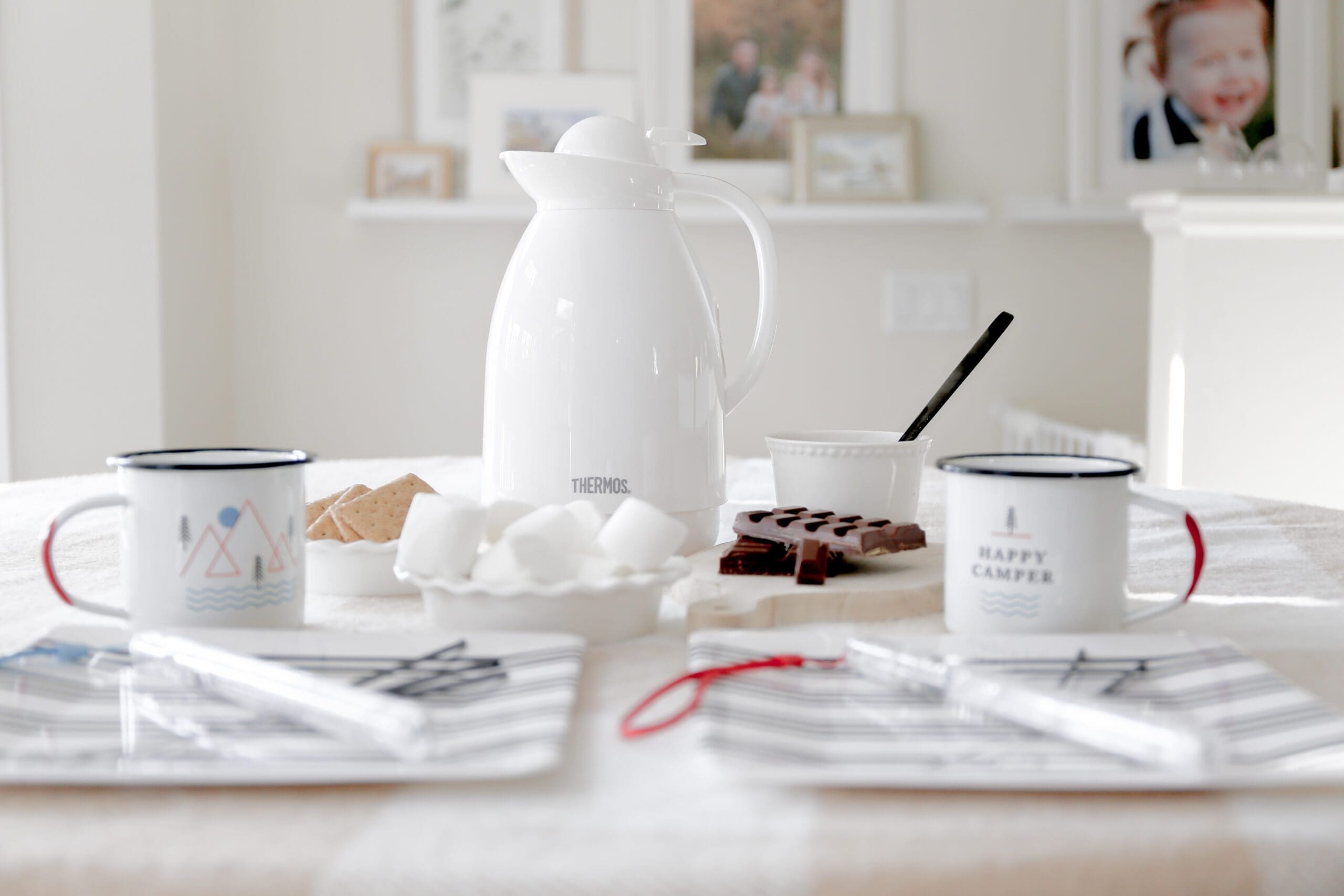 Pitcher of hot chocolate on table