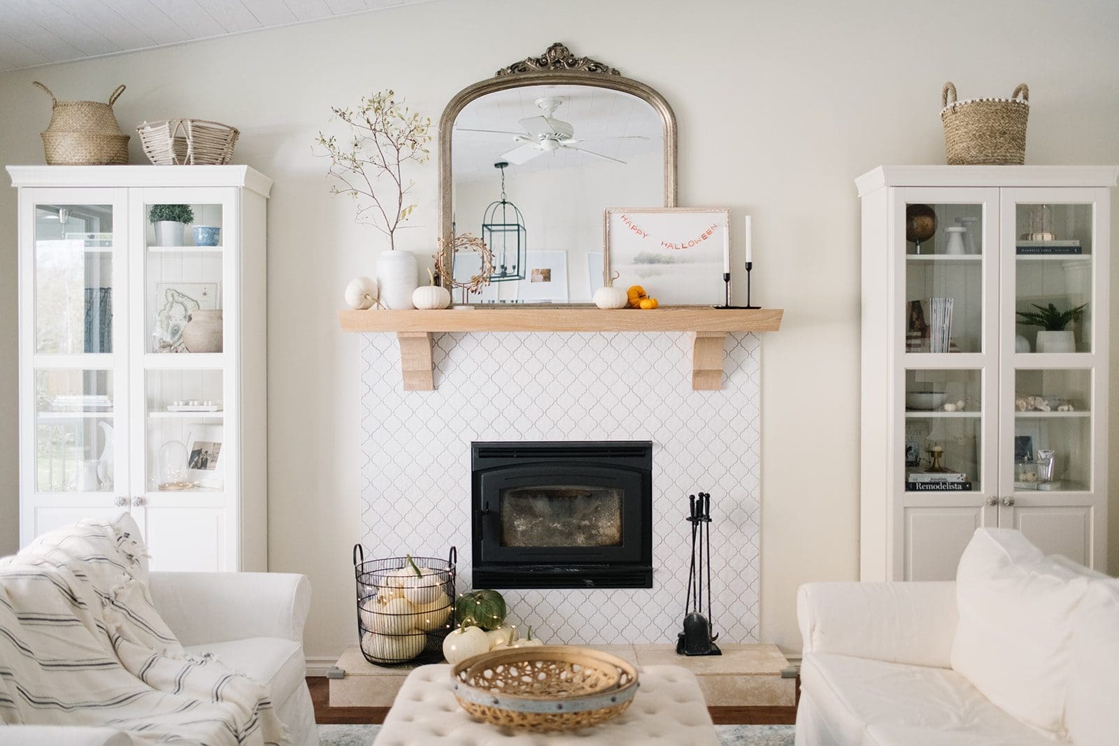 tiny pumpkins on halloween mantle