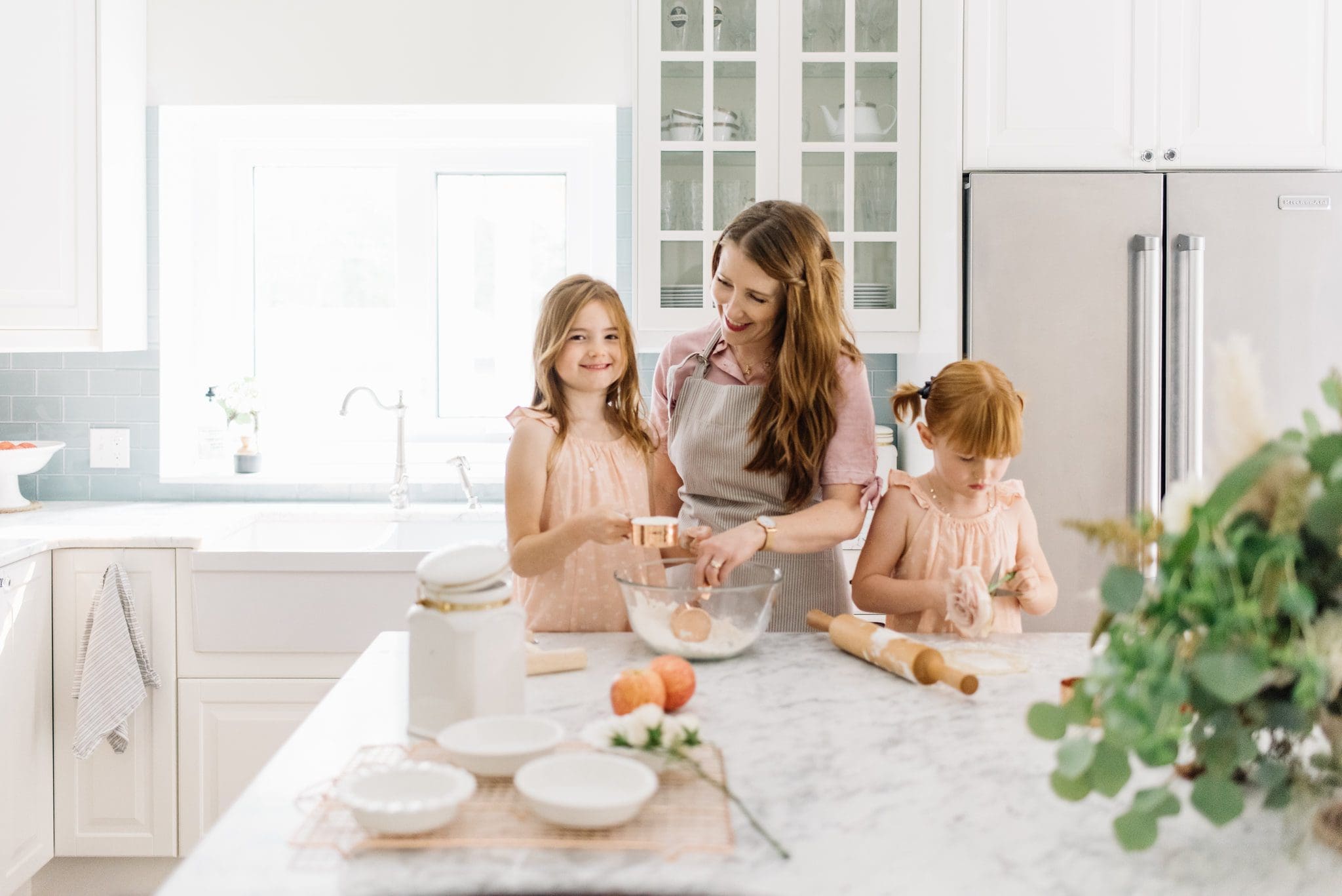 Woman and children baking in the kitchen