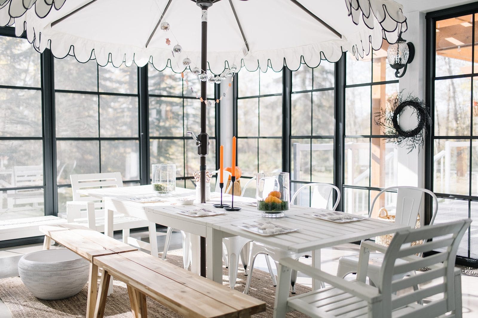 Classy Halloween Tablescape with white table and black and white umbrella