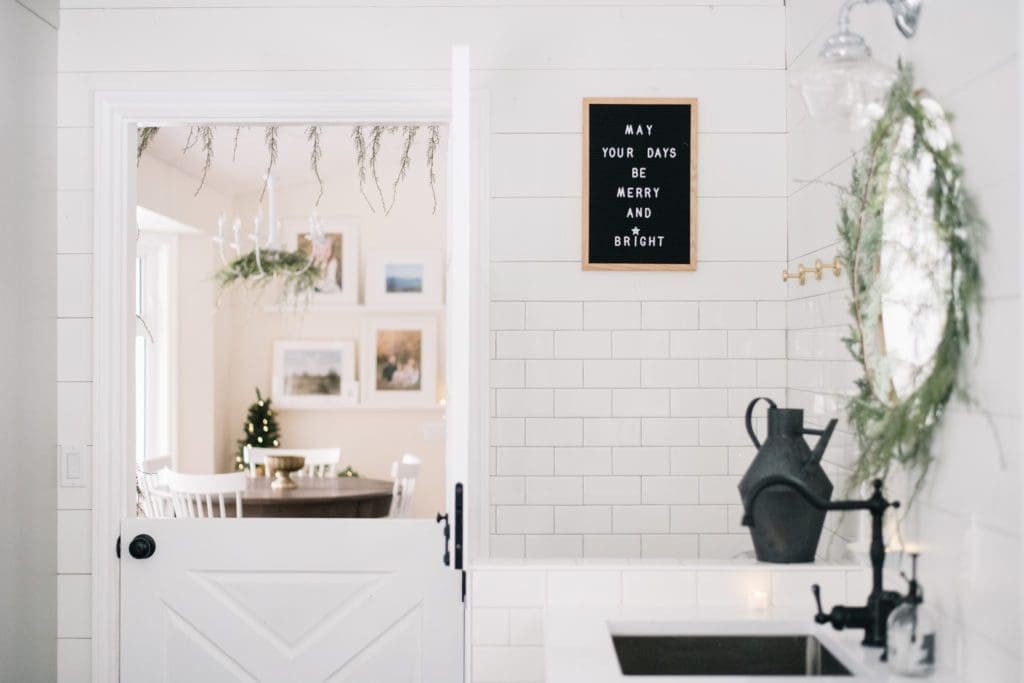 Farmhouse mudroom with Christmas greenery
