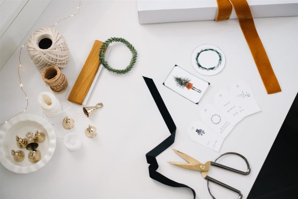 gift tags  and ribbon lying beside scissors