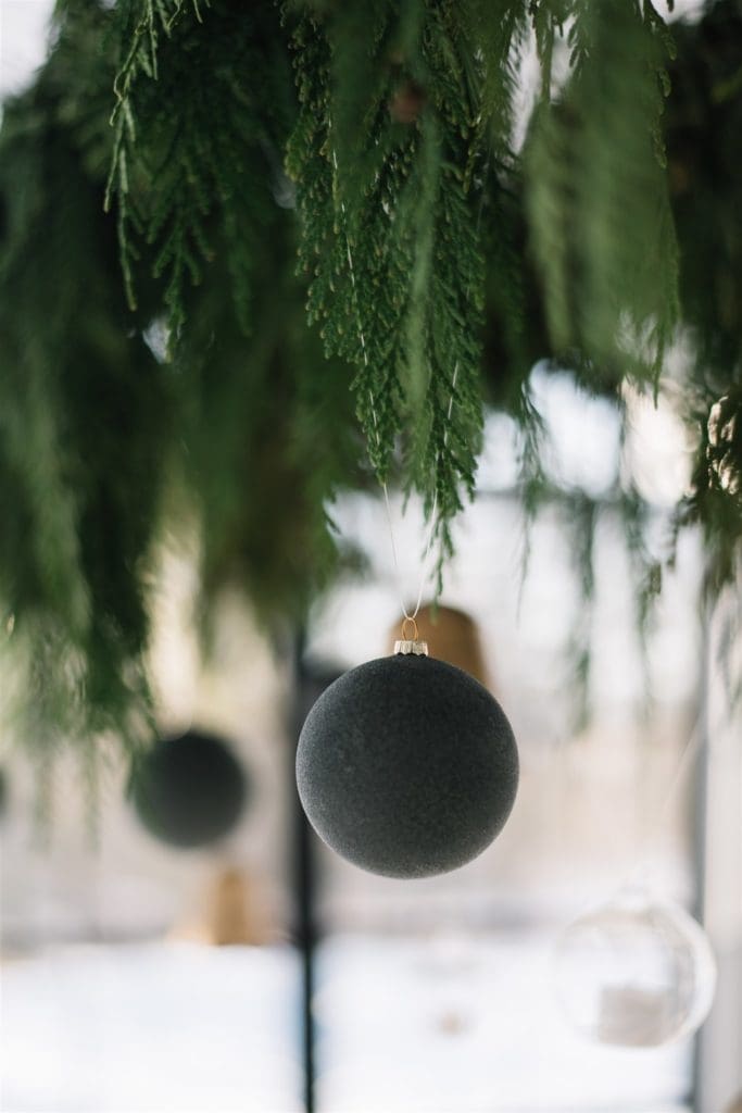 Matte black ornaments add a modern element to minimal Christmas decor