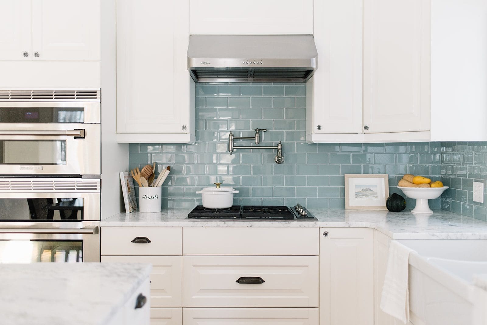 white kitchen with blue backsplash tile