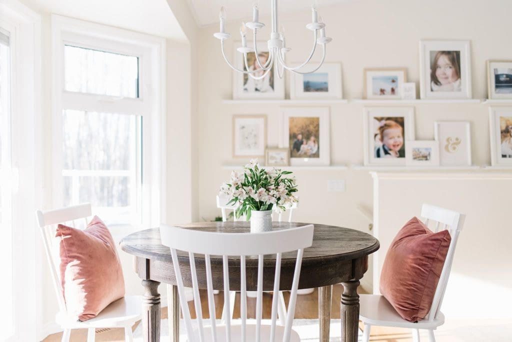 gallery wall makes a small dining space pretty