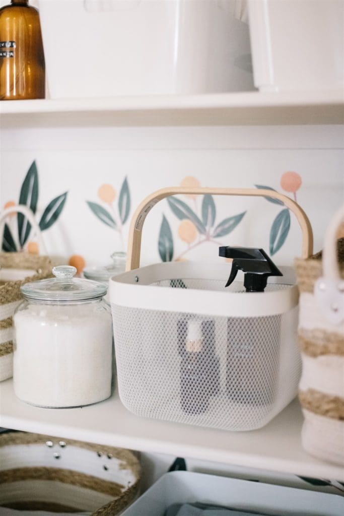white basket with wooden handle