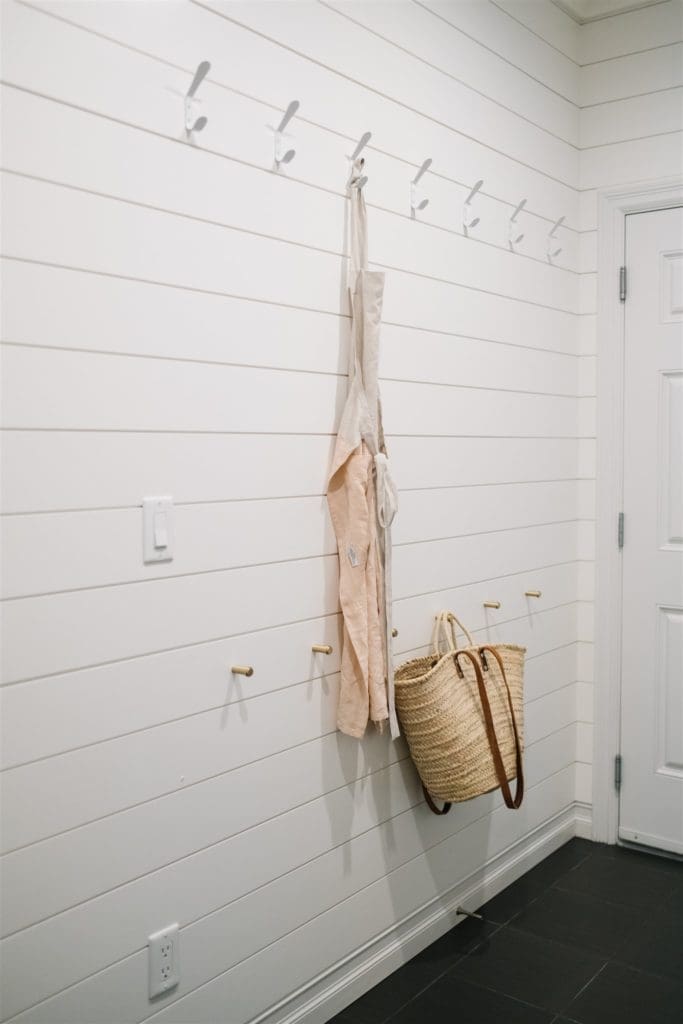 apron hanging on hooks on the wall
