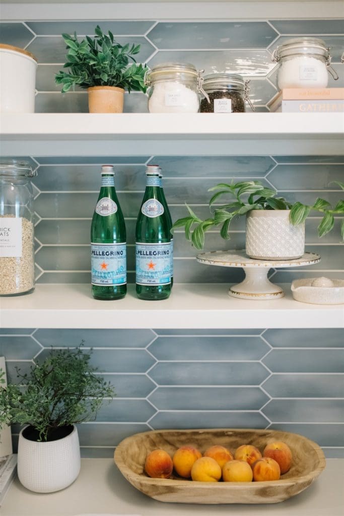 bottles of water on an open shelf