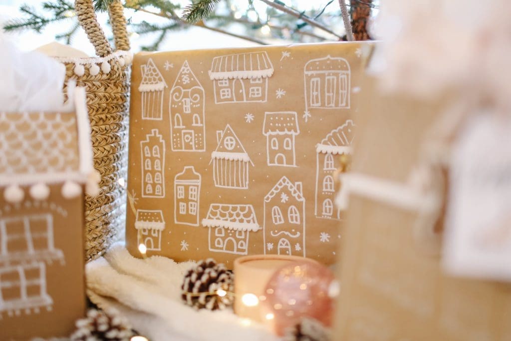 gift wrapped in gingerbread paper under the tree