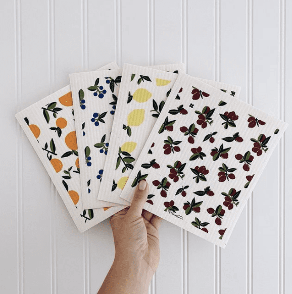 An array of Sponge cloths with orange, blueberry, lemon and cherry patterns