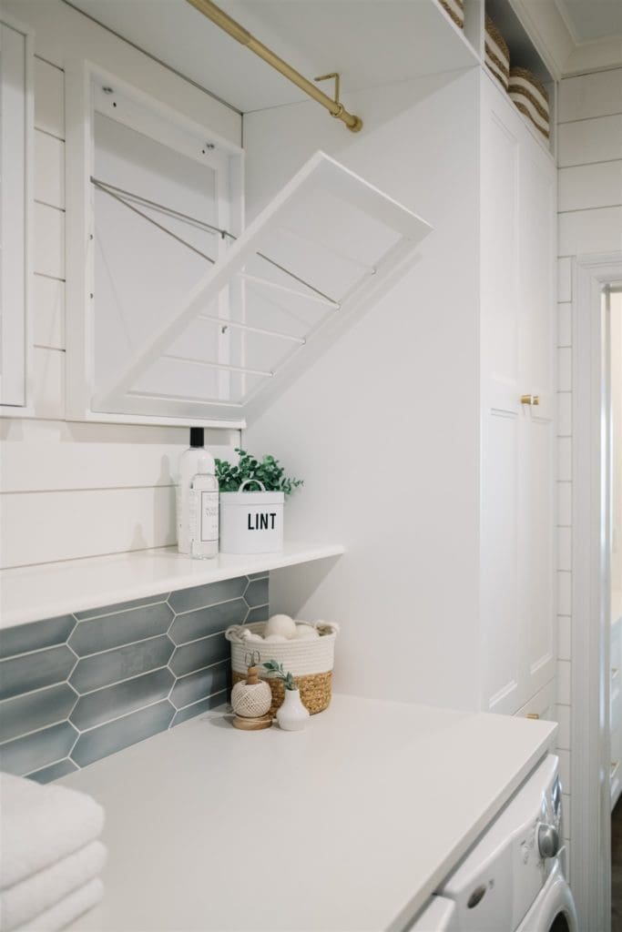 Drying racks above a white counter