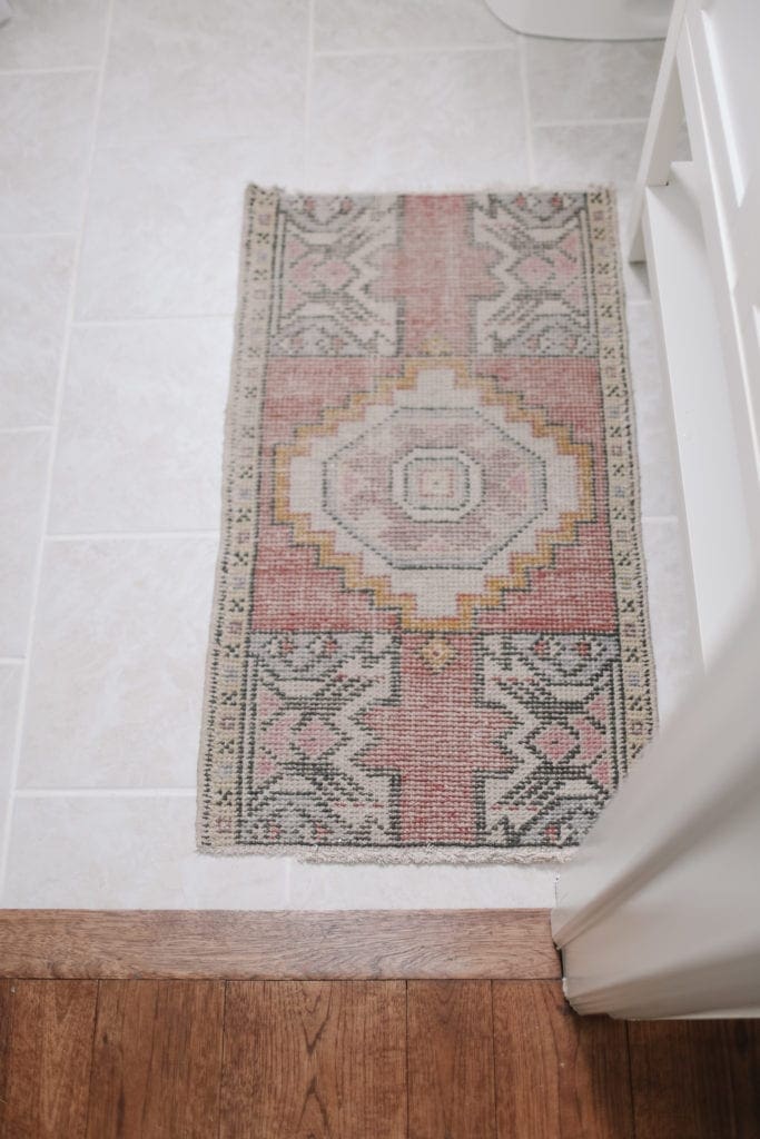 A close up of a vintage pink rug
