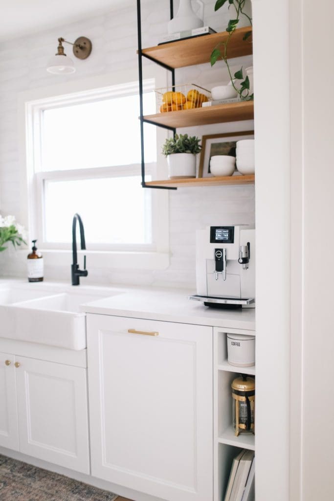 Open shelving beside the kitchen sink