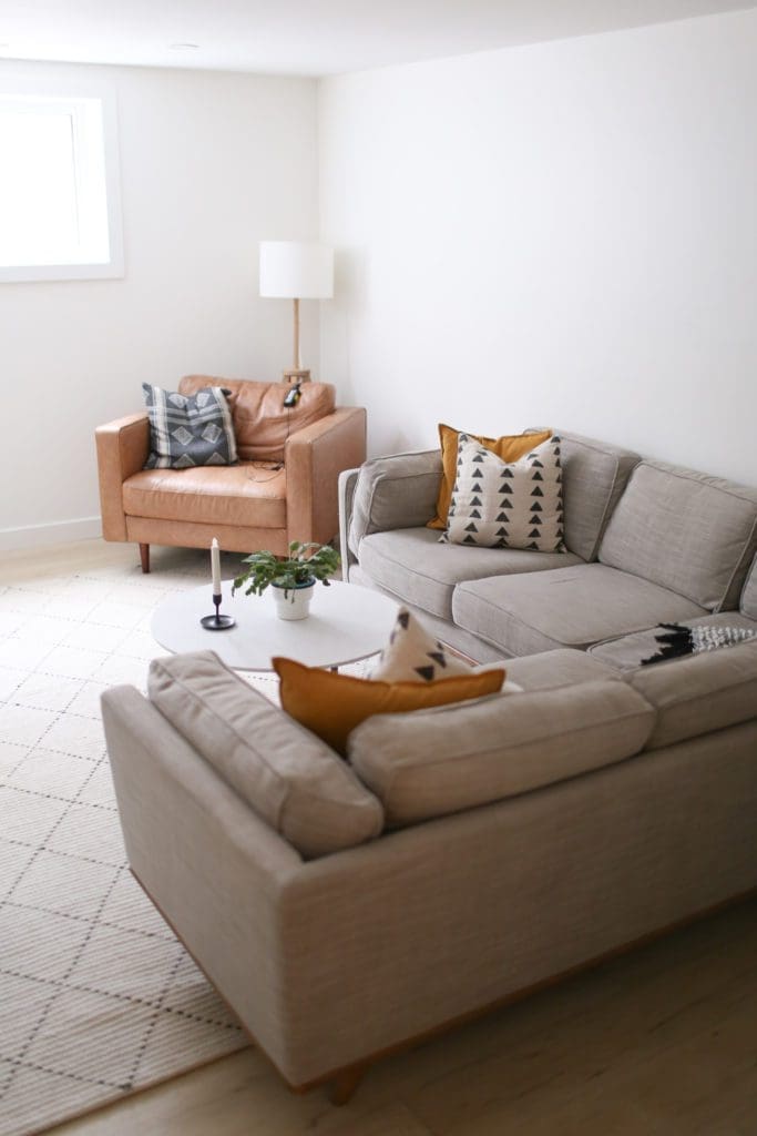 Basement family room with grey sectional