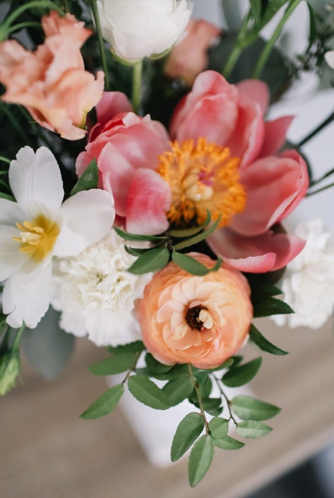 A bouquet of flowers in a vase on a table