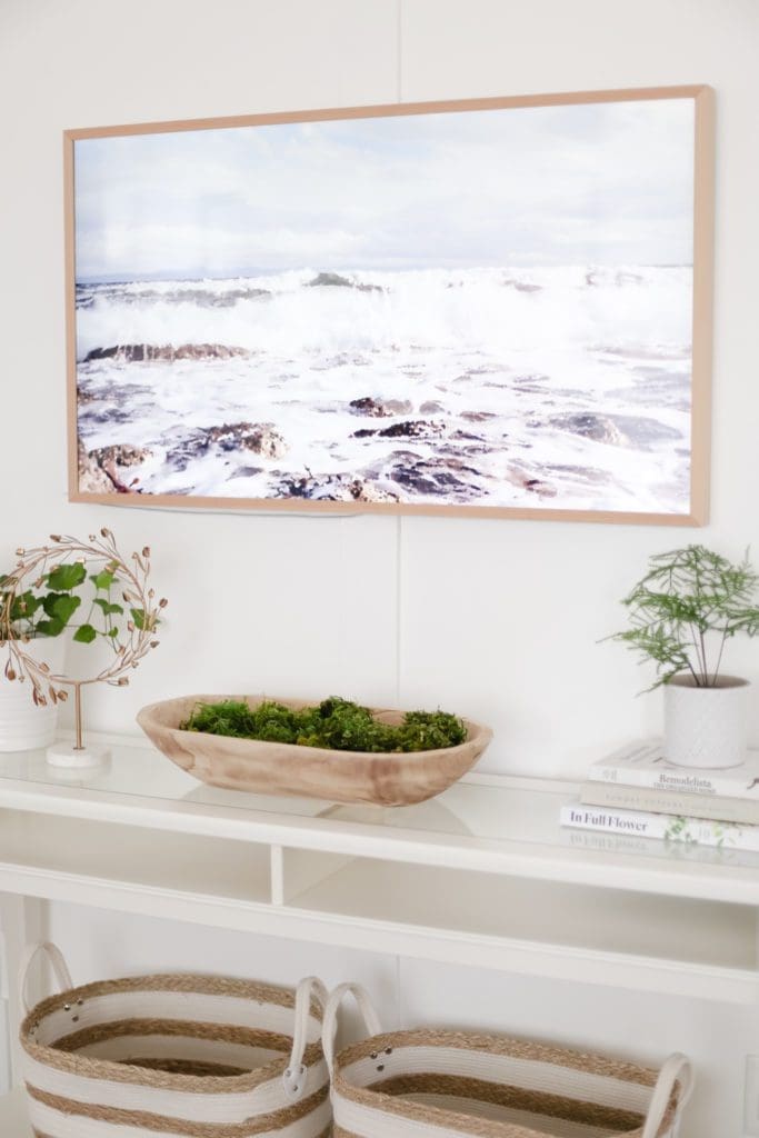 A Samsung Frame TV with a painting of the ocean loaded as art
